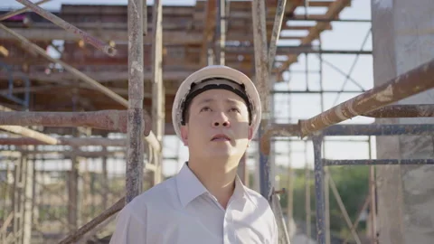 Male engineer construction inspecting the construction site. Stock Footage 176904890