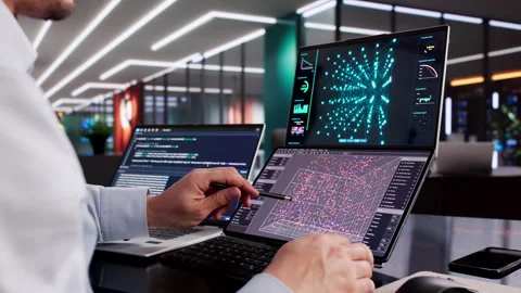 Male Engineer Developing AI Technology Using Multiple Computer Screens Stock Footage 328394623
