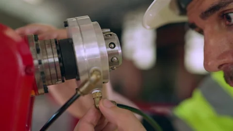 Male engineer doing maintenance robot arm at factory. Stock Footage 229620798