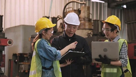 The male engineer examined, signed the document and advised the secretary Stock Footage 130191353