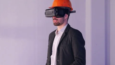 Male engineer in hardhat with VR glasses designing construction project Stock-Footage 74393682