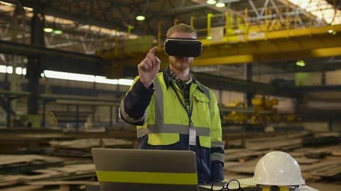 Male engineer in hardhat with VR glasses Stock Footage 106567464