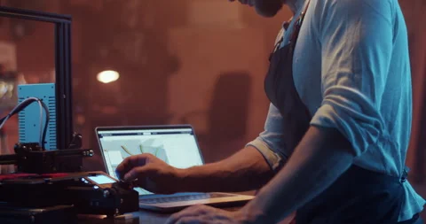 Male engineer operating 3D printer during work in laboratory Stock Footage 259395186