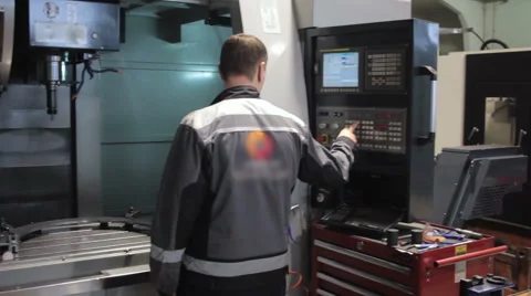 Male Engineer Operating CNC Machinery On Factory Floor 스톡 동영상 60249601