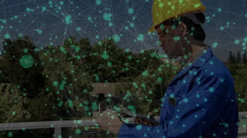 Male engineer operating tablet on elevated platform, displaying tech network Video stock 307859284