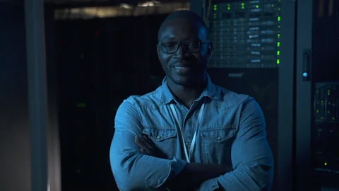 Male engineer posing and smiling during work break on modern render farm spbas. Stock Footage 161744959