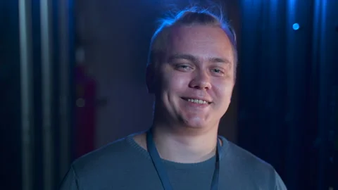 Male engineer posing for camera and smiling while standing in big data center Stock Footage 162224440