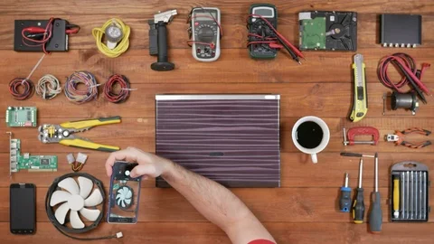 Male engineer programmer makes photo workplace phone. Wooden table top view Stock Footage 72415848