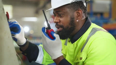 Male engineer is programming a CNC milling machine. Stock Footage 229369588