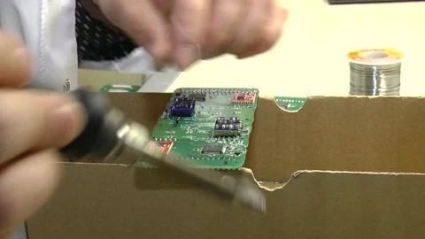 A male engineer repairs an electronic board. Stock-Footage 117567463