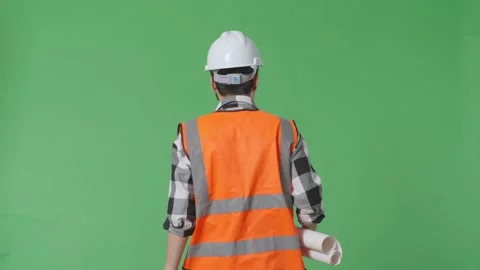 Male Engineer With Safety Helmet Holding Blueprint In His Hands And Looking Video stock 247996341