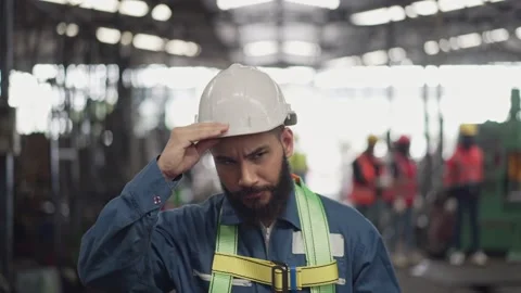 Male engineer in safety uniform walking in the factory Stock Footage 194415422