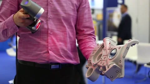 A male engineer scanning item for quality check at modern auto motif industry 動画素材 334644615