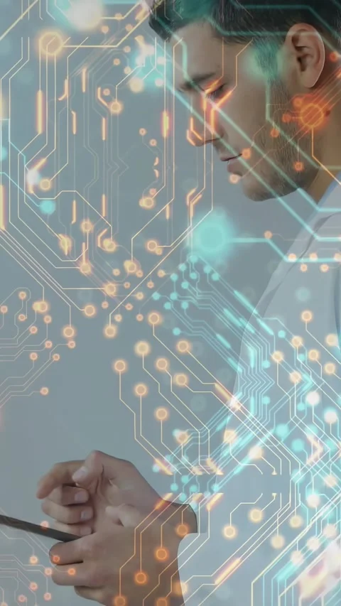 Male engineer tapping tablet and revealing growing circuit graphics covering Stock Footage 330547977
