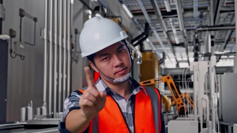 Male Engineer Thinking Then Raising His Index Finger, Battery Factory Stock Footage 314934843
