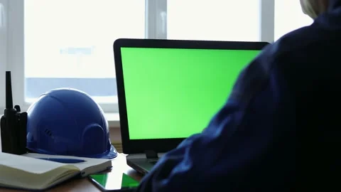 Male Engineer using Laptop Computer with Green Screen inside office. Stock Footage 168578791