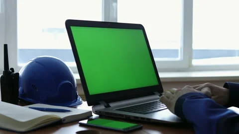 Male Engineer using Laptop Computer with Green Screen inside office. Stock Footage 168578798