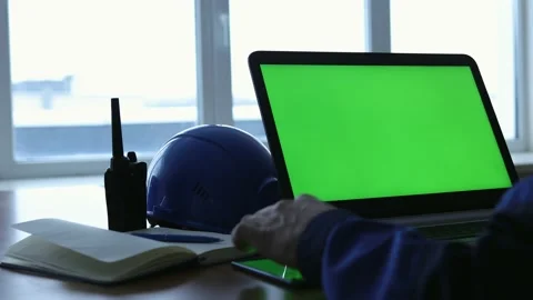 Male Engineer using Laptop Computer with Green Screen inside office. Stock Footage 168578808