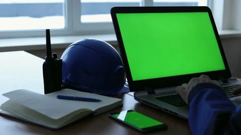 Male Engineer using Laptop Computer with Green Screen inside office. Stock Footage 169385085