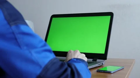 Male Engineer using Laptop Computer with Green Screen inside office. Stock Footage 169385088