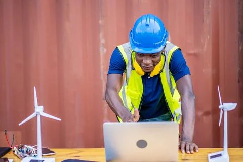 A male engineer using laptop, making video call to client or business partner Stock Photos
