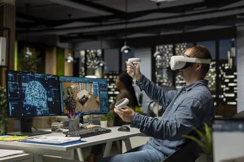 Male engineer using VR headset and AI on interior design software Stock Photos