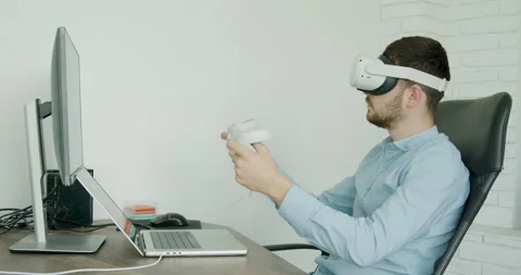 Male engineer wearing virtual reality glasses 3D field models with wind turbines Stock Footage 211876201
