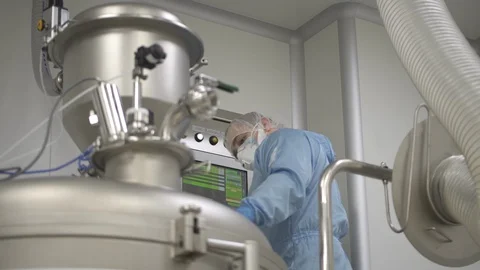 Male engineer working with computer and equipment standing in interior of Stock Footage 123222358