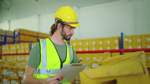 Male engineer working in warehouse store. Stock Footage 241585038