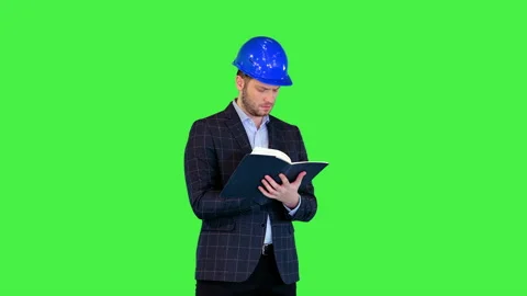 Male engineer writing in notebook on building work done Architect in business 스톡 동영상 157250338