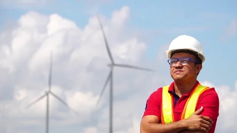 Male engineers are checking the integrity of a wind turbine Stock Footage 105727446