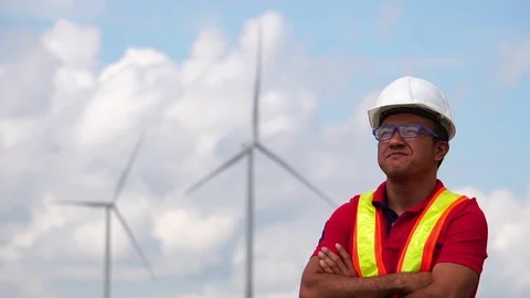 Male engineers are checking the integrity of a wind turbine Stock Footage 105728000