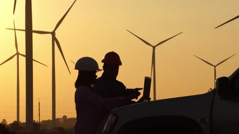 Male engineers are talking about wind turbine system technician woman  스톡 동영상 121238131