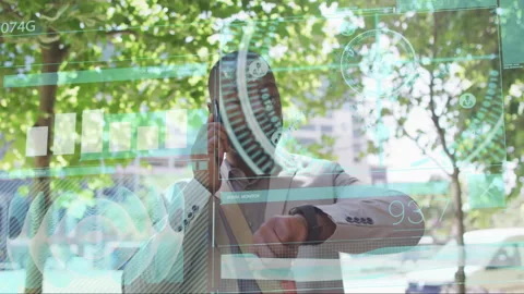 Male executive making call while checking smartwatch outdoors, showing circular Vidéo 307436277