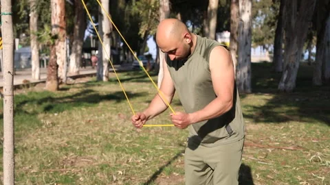 Male exerciser doing biceps exercises Stock Footage 238728300