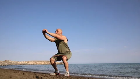 Male exerciser doing biceps exercises Stock Footage 238731136