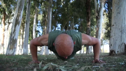 Male exerciser doing biceps exercises Stock Footage 239448665