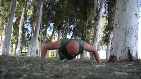 Male exerciser doing biceps exercises push up Stock Footage 239453984