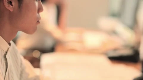 Male face up work in front of desk Stock-Footage 160140001