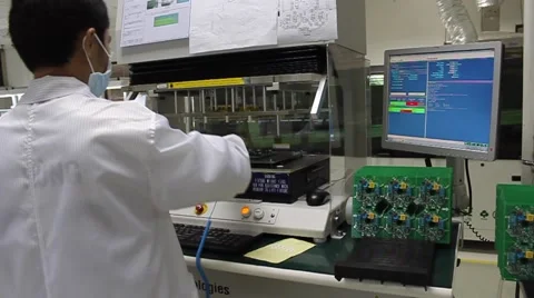Male Factory Worker Testing Technology in Vietnam Stock Footage 44418555
