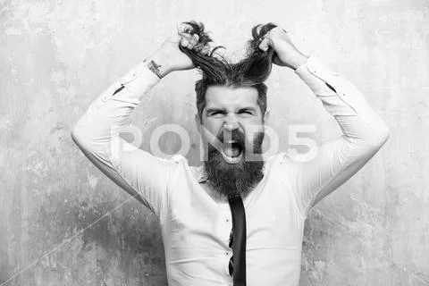 Male fashion, beauty and advertisement concept. man or hipster with long beard Stock Photos