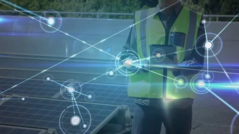 Male field tech tapping tablet, monitoring solar output, AR nodes expanding over Stock Footage 331635460