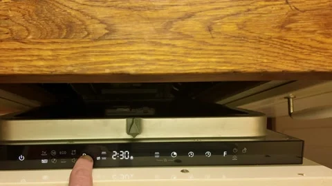 A male finger on the control panel of the dishwasher. Cycles on the dishwasher. Stock Footage 297799793