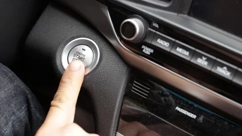A male finger presses start button in the car. Stock Footage 163945650