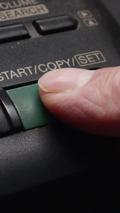 Male Finger Presses The Start Button On Old Dirty Black Fax. Vertical Video stock 268097929