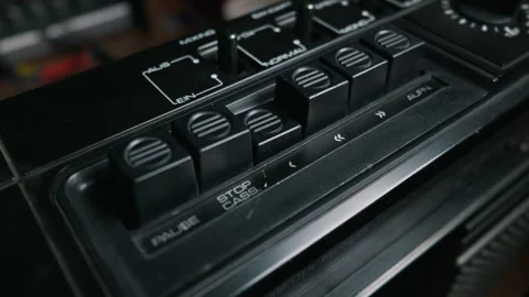 Male Finger Pressing Play Button on Vintage Black Cassette Recorder Stock Footage 333820154