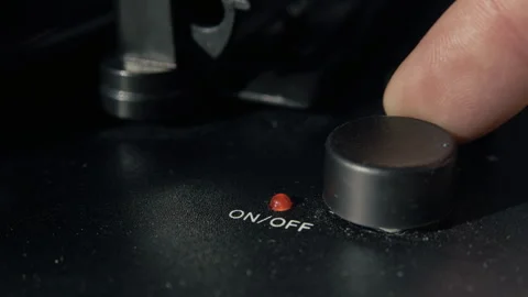 Male Finger Pressing Power Button on Vintage Vinyl Turntable 库存影片 345397220