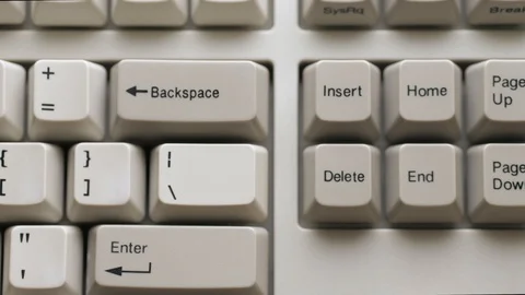 Male finger pushes DELETE button on keyboard. Slow motion and macro view Stock Footage 122197288