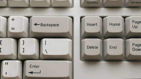 Male finger pushes INSERT button on keyboard. Slow motion and macro view Stock Footage 122197527