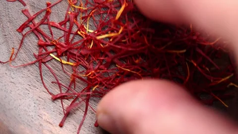 Male fingers picking up a saffron threads Stock Footage 337413339